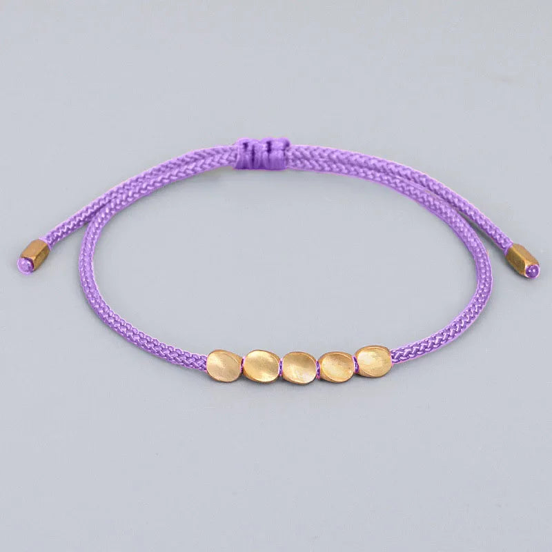 Bracelet de Chance tibétain mauve tissé à la main pour la chance et la protection