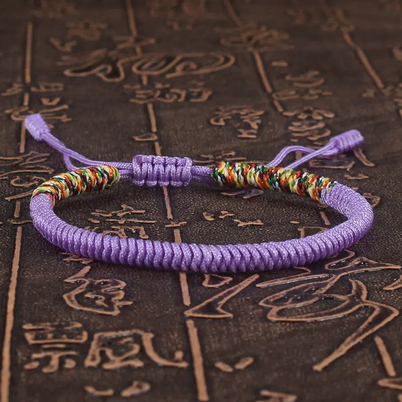 bracelet bouddhiste tibétain porte-bonheur mauve tissé main