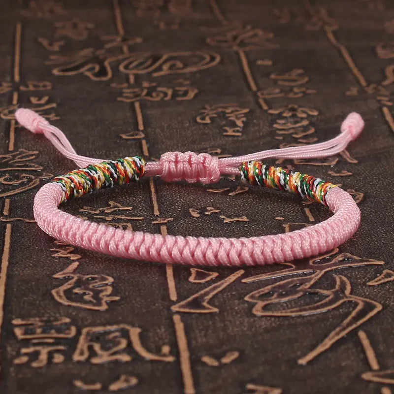 bracelet bouddhiste tibétain porte-bonheur rose tissé main